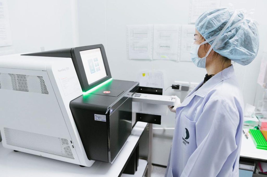 Technician analyzing samples in genetic lab